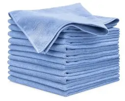 A stack of folded light blue microfiber cloths for auto detailing.