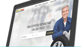 Laptop screen displaying a website with a header advertising certified technicians at Add-On Profit Centers, featuring a smiling man in a mechanic's uniform.