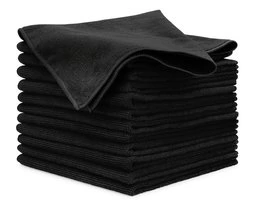 A stack of folded black microfiber cloths for auto detailing on a white background.