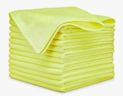 A stack of neatly folded light green microfiber cloths for auto detailing on a white background.